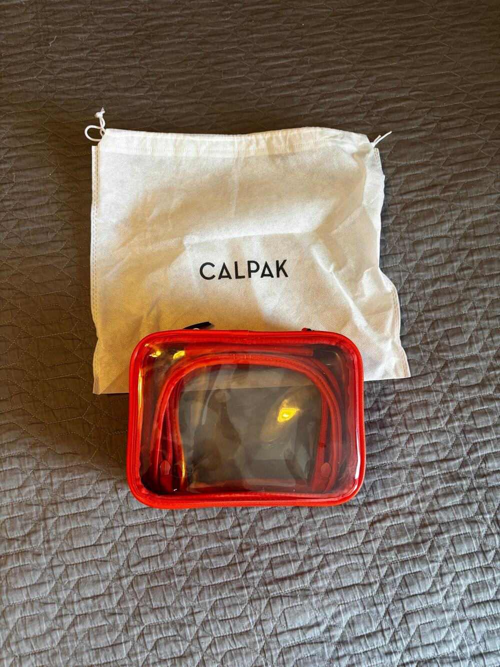 Calpak Small Clear Cosmetics Case in Limited Edition Papaya